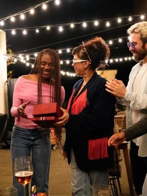 friends-giving-gifts-at-birthday-party-on-rooftop-2025-03-09-23-42-11-utc