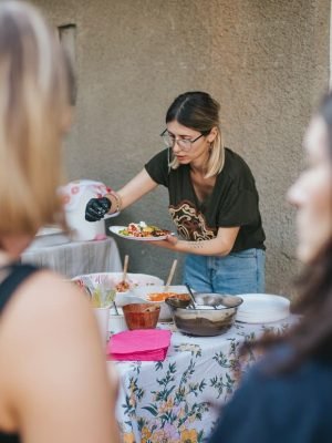 tattooed-chef-seasoning-with-chilli-the-plate-with-2024-10-16-14-16-50-utc